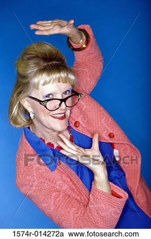 Stock Image - Portrait of a senior woman gesturing. Fotosearch