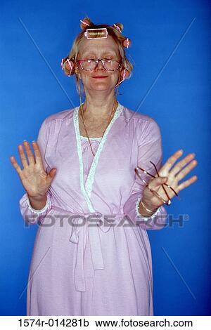 Portrait of a senior woman gesturing View Large Photo Image Stock Image - Portrait of a senior woman gesturing. Fotosearch