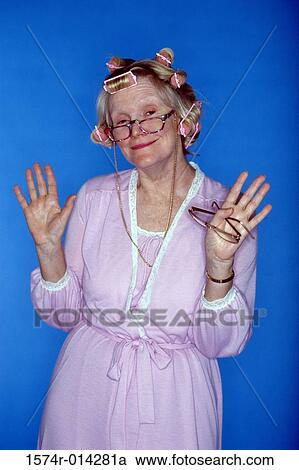 Portrait of a senior woman with curlers in her hair View Large Photo Image Stock Image - Portrait of a senior woman with curlers in her hair. Fotosearch