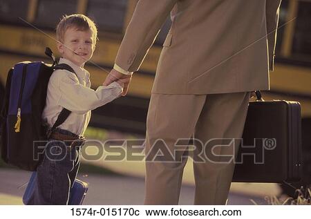Portrait of a son holding his father's hand View Large Photo Image Stock Image - Portrait of a son holding his father's hand. Fotosearch