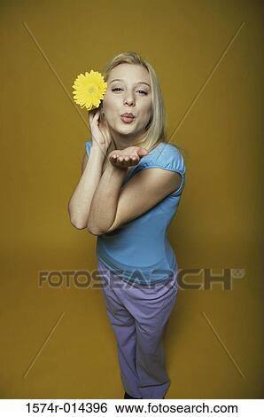 Portrait of a teenage girl blowing a kiss View Large Photo Image Stock Photograph - Portrait of a teenage girl blowing a kiss. Fotosearch