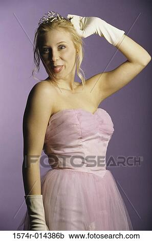 Portrait of a teenage girl sticking her tongue out View Large Photo Image Stock Image - Portrait of a teenage girl sticking her tongue out. Fotosearch