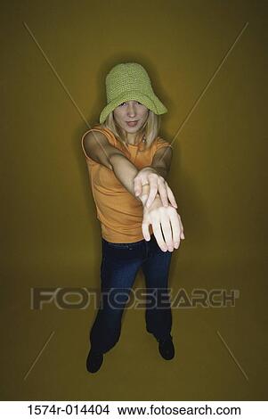 Picture - Portrait of a teenage girl stretching her arms. Fotosearch