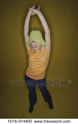 Portrait of a teenage girl stretching her arms View Large Photo Image Stock Image - Portrait of a teenage girl stretching her arms. Fotosearch