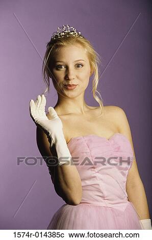 Stock Image - Portrait of a teenage girl waving her hand. Fotosearch