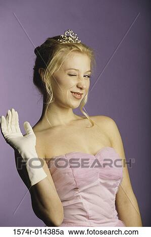 Stock Image - Portrait of a teenage girl winking. Fotosearch