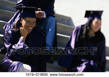 Portrait of a teenage graduate girl sitting on steps and smiling View Large Photo Image Stock Photography - Portrait of a teenage graduate girl sitting on steps and smiling. Fotosearch