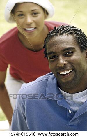 Portrait of a young couple smiling View Large Photo Image Stock Photo - Portrait of a young couple smiling. Fotosearch