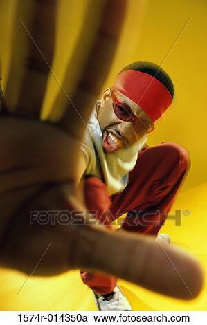 Portrait of a young man showing a stop gesture View Large Photo Image Stock Image - Portrait of a young man showing a stop gesture. Fotosearch
