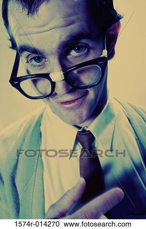 Stock Image - Portrait of a young man wearing eyeglasses. Fotosearch