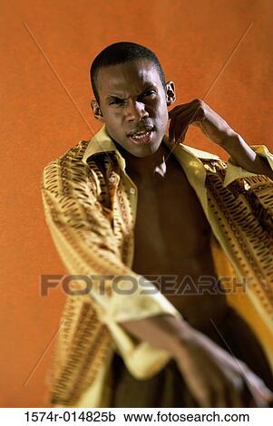 Portrait of a young man with his shirt unbuttoned View Large Photo Image Stock Image - Portrait of a young man with his shirt unbuttoned. Fotosearch