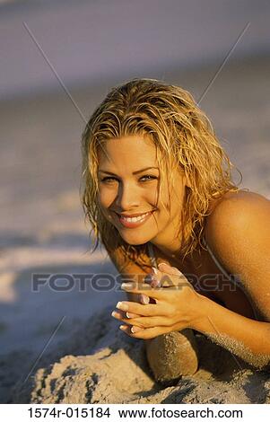 Portrait of a young woman smiling on the beach View Large Photo Image Picture - Portrait of a young woman smiling on the beach. Fotosearch