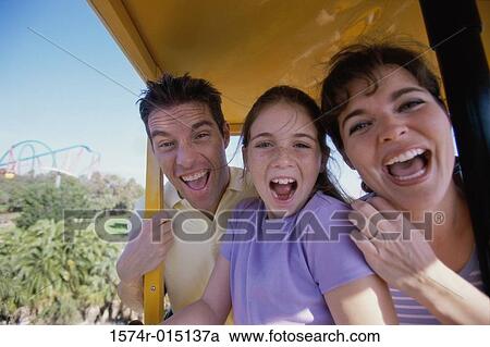 Portrait of parents and their daughter laughing View Large Photo Image Stock Image - Portrait of parents and their daughter laughing. Fotosearch