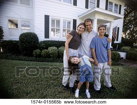 Portrait of parents standing with their son and daughter View Large Photo Image Stock Image - Portrait of parents standing with their son and daughter. Fotosearch