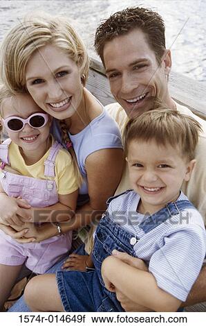 Portrait of parents with their son and daughter View Large Photo Image Stock Image - Portrait of parents with their son and daughter. Fotosearch