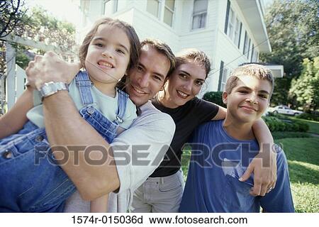 Portrait of parents with their son and daughter smiling View Large Photo Image Stock Image - Portrait of parents with their son and daughter smiling. Fotosearch