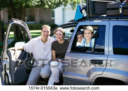 Portrait of parents with their son and daughter sitting in a car View Large Photo Image Stock Image - Portrait of parents with their son and daughter sitting in a car. Fotosearch