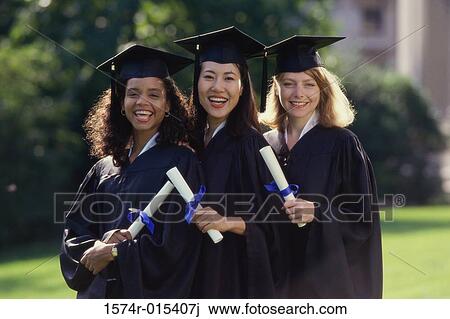 Portrait of three young women wearing graduation gowns and holding diplomas View Large Photo Image Stock Image - Portrait of three young women wearing graduation gowns and holding diplomas. Fotosearch