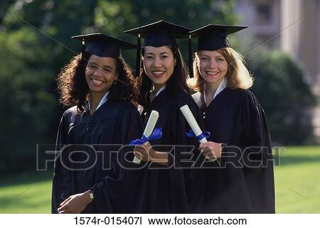 Portrait of three young women wearing graduation gowns and holding diplomas View Large Photo Image Stock Image - Portrait of three young women wearing graduation gowns and holding diplomas. Fotosearch