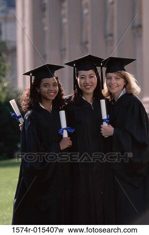 Portrait of three young women wearing graduation gowns and holding diplomas View Large Photo Image Stock Photo - Portrait of three young women wearing graduation gowns and holding diplomas. Fotosearch
