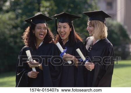 Portrait of three young women wearing graduation gowns and holding diplomas View Large Photo Image Stock Photograph - Portrait of three young women wearing graduation gowns and holding diplomas. Fotosearch