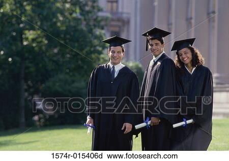 Portrait of two male graduates with a female graduate holding diplomas View Large Photo Image Stock Image - Portrait of two male graduates with a female graduate holding diplomas. Fotosearch