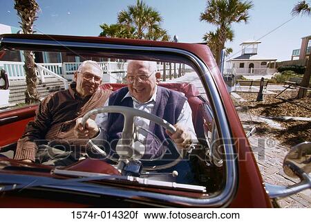 Portrait of two senior men sitting in a convertible car View Large Photo Image Stock Image - Portrait of two senior men sitting in a convertible car. Fotosearch