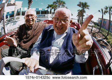 Portrait of two senior men sitting in a convertible car View Large Photo Image Stock Image - Portrait of two senior men sitting in a convertible car. Fotosearch