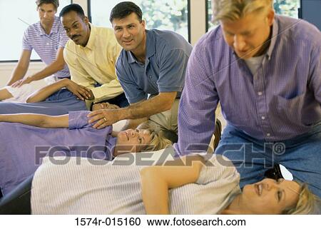 Pregnant wives and their husbands in a prenatal class View Large Photo Image Stock Image - Pregnant wives and their husbands in a prenatal class. Fotosearch