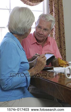 Senior couple looking at each other View Large Photo Image Stock Image - Senior couple looking at each other. Fotosearch
