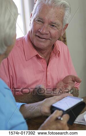 Senior couple talking to each other View Large Photo Image Stock Image - Senior couple talking to each other. Fotosearch