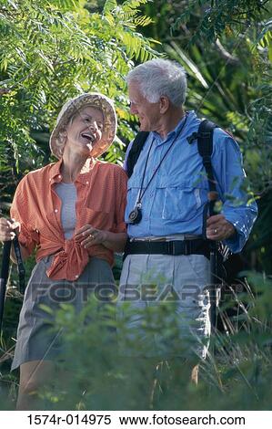 Senior couple walking in a forest View Large Photo Image Stock Photography - Senior couple walking in a forest. Fotosearch