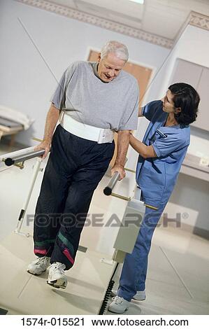 Side profile of a female nurse helping a patient to walk View Large Photo Image Stock Image - Side profile of a female nurse helping a patient to walk. Fotosearch