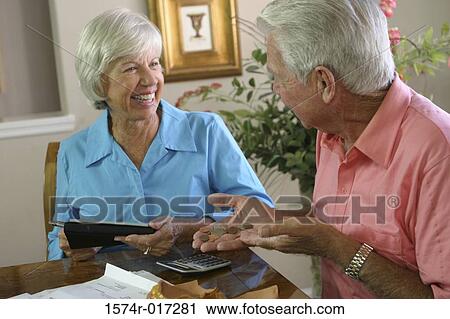 Side profile of a senior man sitting with a senior woman smiling View Large Photo Image Stock Image - Side profile of a senior man sitting with a senior woman smiling. Fotosearch