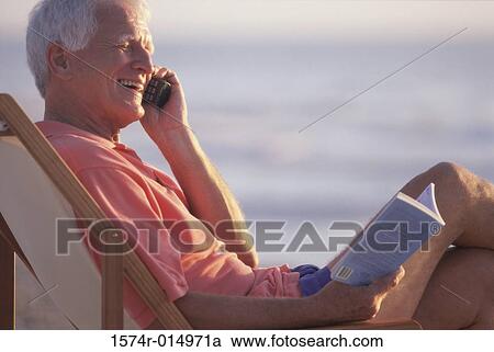 Side profile of a senior man talking on a mobile phone View Large Photo Image Stock Image - Side profile of a senior man talking on a mobile phone. Fotosearch