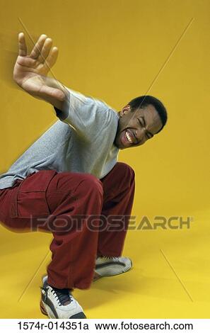 Side profile of a young man showing a stop gesture View Large Photo Image Stock Image - Side profile of a young man showing a stop gesture. Fotosearch