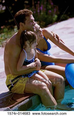 Side profile of parents and their daughter sitting at poolside View Large Photo Image Stock Image - Side profile of parents and their daughter sitting at poolside. Fotosearch