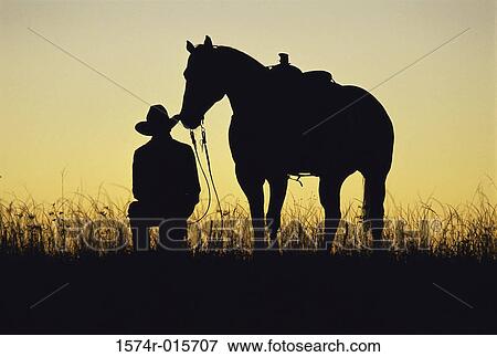Silhouette of a cowboy and a horse View Large Photo Image Stock Photo - Silhouette of a cowboy and a horse. Fotosearch