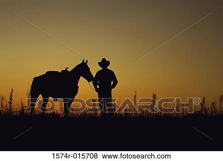Silhouette of a cowboy and a horse View Large Photo Image Stock Photo - Silhouette of a cowboy and a horse. Fotosearch