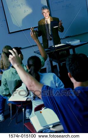 Teacher teaching in a classroom View Large Photo Image Stock Image - Teacher teaching in a classroom. Fotosearch