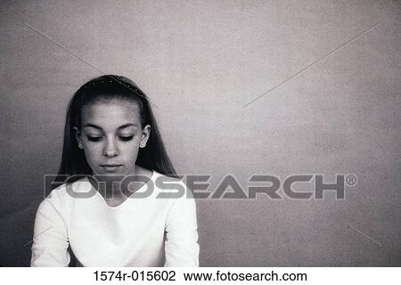Teenage girl looking down View Large Photo Image Stock Image - Teenage girl looking down. Fotosearch