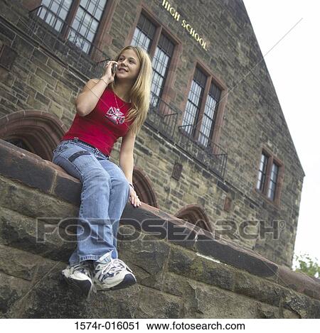 Stock Image - Teenage girl talking on a mobile phone. Fotosearch