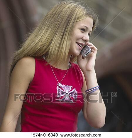 Teenage girl talking on a mobile phone View Large Photo Image Stock Photo - Teenage girl talking on a mobile phone. Fotosearch