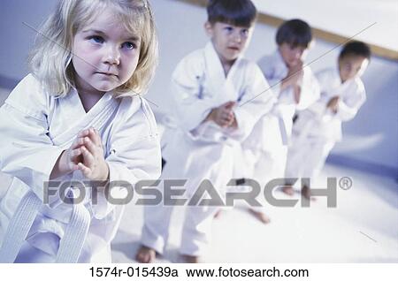 Three boys and a girl learning martial arts View Large Photo Image Stock Image - Three boys and a girl learning martial arts. Fotosearch