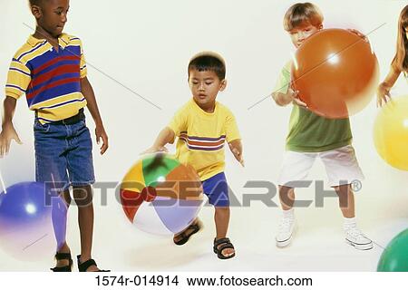 Three boys playing with balls View Large Photo Image Picture - Three boys playing with balls. Fotosearch