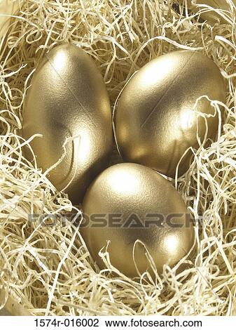 Three golden eggs in a nest View Large Photo Image Stock Image - Three golden eggs in a nest. Fotosearch