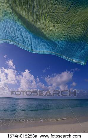 Towel fluttering on the beach View Large Photo Image Stock Image - Towel fluttering on the beach. Fotosearch