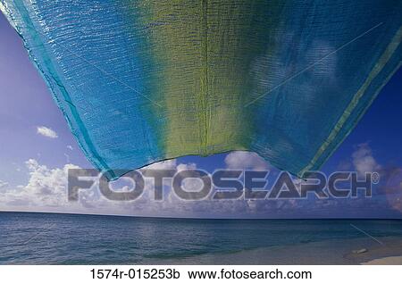 Towel fluttering on the beach View Large Photo Image Stock Image - Towel fluttering on the beach. Fotosearch
