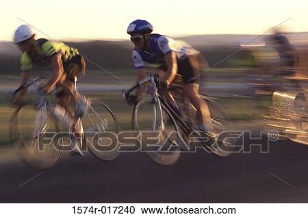 Stock Image - Two cyclist participating in a race. Fotosearch