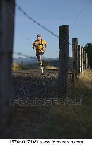 Stock Photo - Young man jogging. Fotosearch